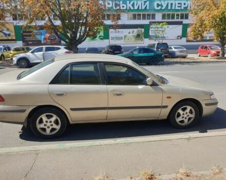 Серый Мазда 626, объемом двигателя 2 л и пробегом 400 тыс. км за 900 $, фото 1 на Automoto.ua