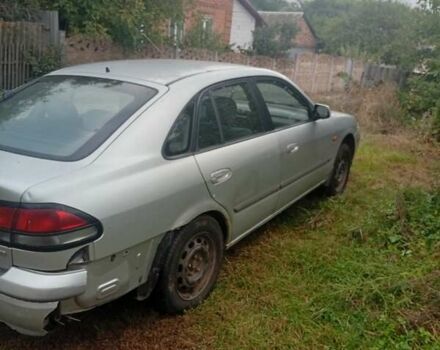 Серый Мазда 626, объемом двигателя 2 л и пробегом 250 тыс. км за 1999 $, фото 1 на Automoto.ua