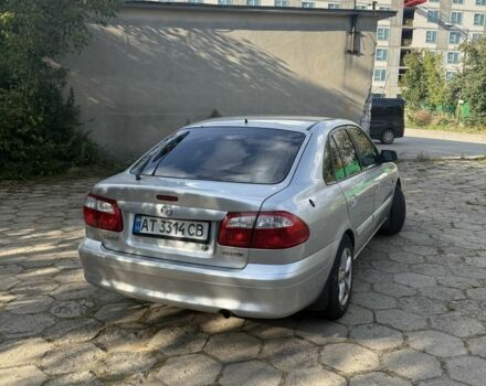 Серый Мазда 626, объемом двигателя 1.8 л и пробегом 299 тыс. км за 2400 $, фото 1 на Automoto.ua