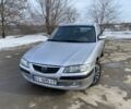 Серый Мазда 626, объемом двигателя 2 л и пробегом 280 тыс. км за 2000 $, фото 1 на Automoto.ua