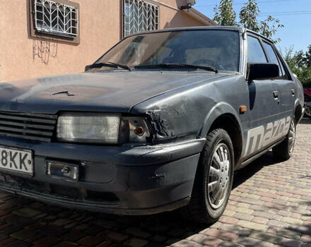 Серый Мазда 626, объемом двигателя 2 л и пробегом 310 тыс. км за 700 $, фото 1 на Automoto.ua