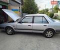 Серый Мазда 626, объемом двигателя 2 л и пробегом 379 тыс. км за 1004 $, фото 1 на Automoto.ua