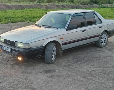 Серый Мазда 626, объемом двигателя 2 л и пробегом 400 тыс. км за 1100 $, фото 1 на Automoto.ua