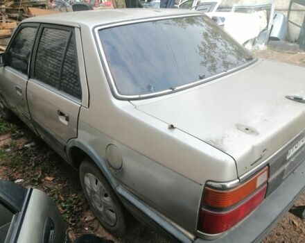 Серый Мазда 626, объемом двигателя 2 л и пробегом 400 тыс. км за 287 $, фото 2 на Automoto.ua