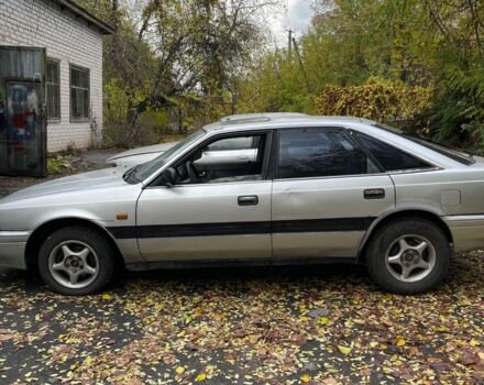 Серый Мазда 626, объемом двигателя 2 л и пробегом 200 тыс. км за 950 $, фото 1 на Automoto.ua