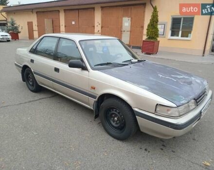 Серый Мазда 626, объемом двигателя 2 л и пробегом 449 тыс. км за 1300 $, фото 1 на Automoto.ua