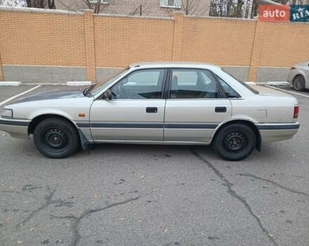 Серый Мазда 626, объемом двигателя 2 л и пробегом 449 тыс. км за 1300 $, фото 3 на Automoto.ua