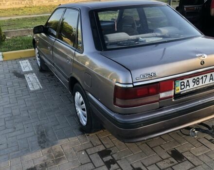 Серый Мазда 626, объемом двигателя 2 л и пробегом 300 тыс. км за 1700 $, фото 2 на Automoto.ua