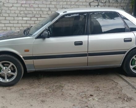 Серый Мазда 626, объемом двигателя 2 л и пробегом 400 тыс. км за 961 $, фото 1 на Automoto.ua