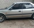 Серый Мазда 626, объемом двигателя 2 л и пробегом 400 тыс. км за 961 $, фото 1 на Automoto.ua