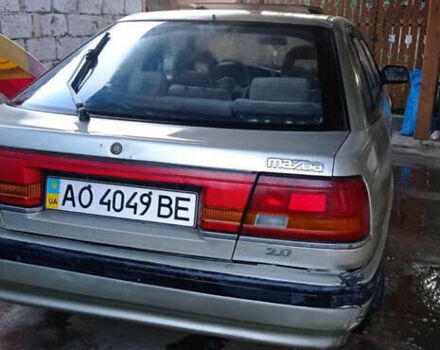 Серый Мазда 626, объемом двигателя 2 л и пробегом 322 тыс. км за 650 $, фото 1 на Automoto.ua