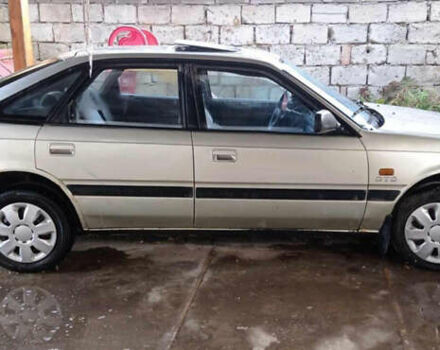 Серый Мазда 626, объемом двигателя 2 л и пробегом 322 тыс. км за 650 $, фото 3 на Automoto.ua