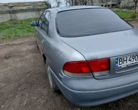 Серый Мазда 626, объемом двигателя 2 л и пробегом 297 тыс. км за 1700 $, фото 1 на Automoto.ua