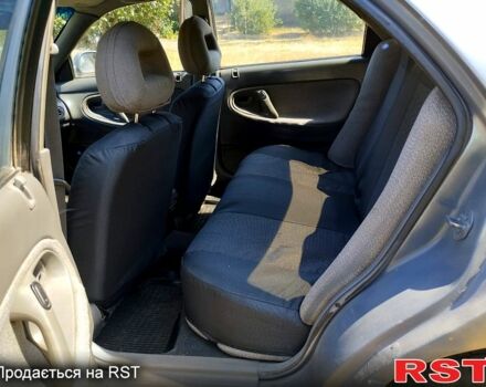 Серый Мазда 626, объемом двигателя 2 л и пробегом 297 тыс. км за 1600 $, фото 2 на Automoto.ua