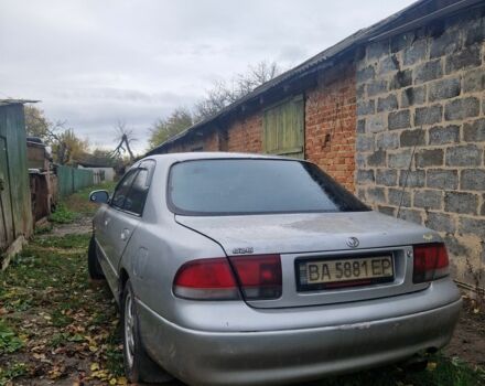 Серый Мазда 626, объемом двигателя 2 л и пробегом 422 тыс. км за 3000 $, фото 1 на Automoto.ua