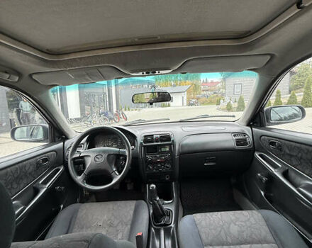 Сірий Мазда 626, об'ємом двигуна 1.8 л та пробігом 276 тис. км за 2000 $, фото 9 на Automoto.ua