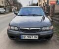 Серый Мазда 626, объемом двигателя 2 л и пробегом 243 тыс. км за 2560 $, фото 1 на Automoto.ua