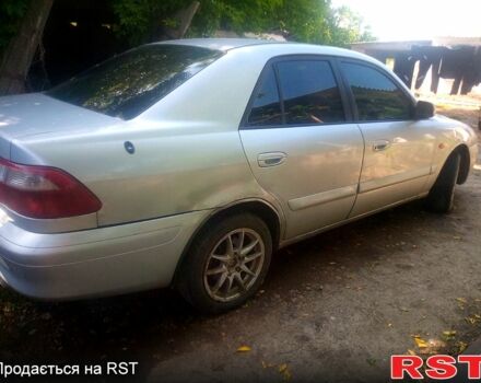 Серый Мазда 626, объемом двигателя 2 л и пробегом 301 тыс. км за 2750 $, фото 1 на Automoto.ua