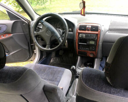 Серый Мазда 626, объемом двигателя 2 л и пробегом 123 тыс. км за 3100 $, фото 28 на Automoto.ua