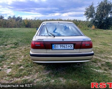 Серый Мазда 626, объемом двигателя 2 л и пробегом 370 тыс. км за 1950 $, фото 6 на Automoto.ua