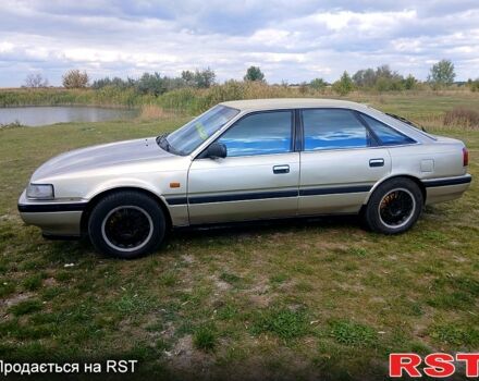 Серый Мазда 626, объемом двигателя 2 л и пробегом 370 тыс. км за 1950 $, фото 1 на Automoto.ua