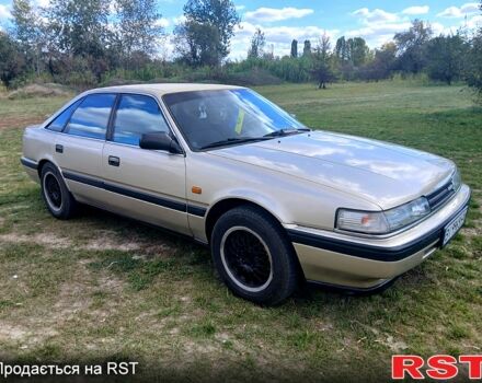 Серый Мазда 626, объемом двигателя 2 л и пробегом 370 тыс. км за 1950 $, фото 2 на Automoto.ua