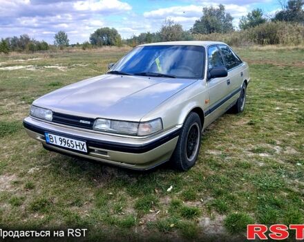 Серый Мазда 626, объемом двигателя 2 л и пробегом 370 тыс. км за 1950 $, фото 3 на Automoto.ua