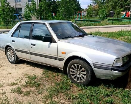 Серый Мазда 626, объемом двигателя 2 л и пробегом 200 тыс. км за 1000 $, фото 1 на Automoto.ua