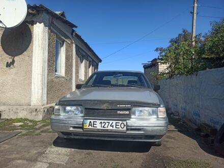 Сірий Мазда 626, об'ємом двигуна 2 л та пробігом 323 тис. км за 1000 $, фото 1 на Automoto.ua