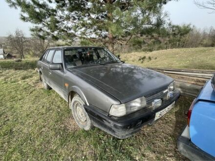 Серый Мазда 626, объемом двигателя 2 л и пробегом 222 тыс. км за 930 $, фото 1 на Automoto.ua