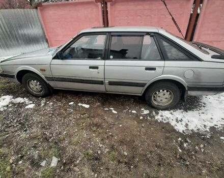 Серый Мазда 626, объемом двигателя 2 л и пробегом 310 тыс. км за 1 $, фото 1 на Automoto.ua