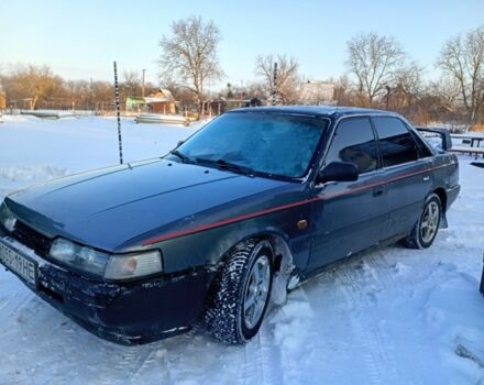 Серый Мазда 626, объемом двигателя 2 л и пробегом 1000 тыс. км за 600 $, фото 1 на Automoto.ua