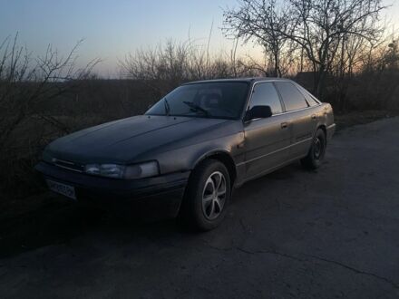 Серый Мазда 626, объемом двигателя 2 л и пробегом 450 тыс. км за 903 $, фото 1 на Automoto.ua