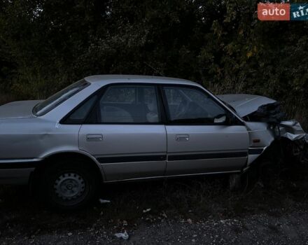 Серый Мазда 626, объемом двигателя 2 л и пробегом 357 тыс. км за 600 $, фото 1 на Automoto.ua
