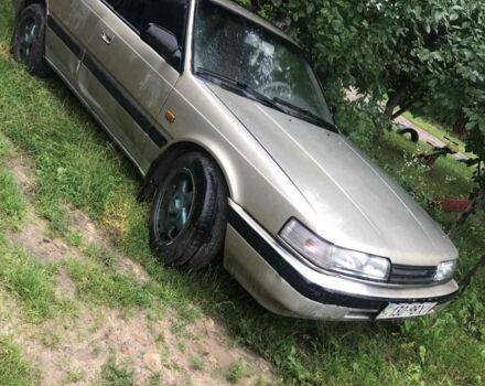 Серый Мазда 626, объемом двигателя 2.2 л и пробегом 377 тыс. км за 500 $, фото 1 на Automoto.ua
