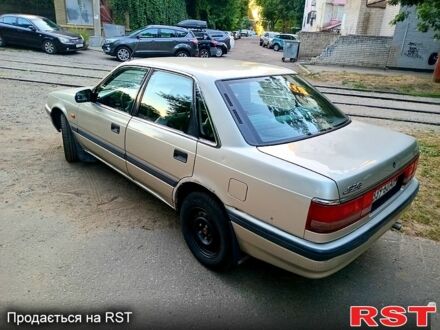 Серый Мазда 626, объемом двигателя 2 л и пробегом 447 тыс. км за 1300 $, фото 1 на Automoto.ua