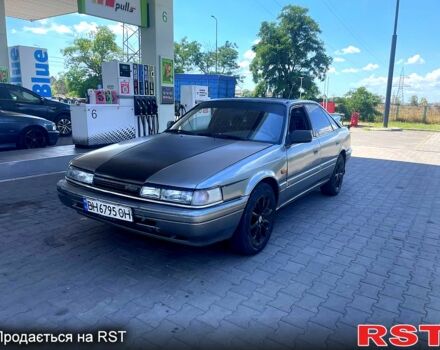 Серый Мазда 626, объемом двигателя 2.2 л и пробегом 210 тыс. км за 450 $, фото 1 на Automoto.ua