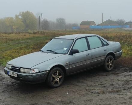 Серый Мазда 626, объемом двигателя 2 л и пробегом 400 тыс. км за 1547 $, фото 1 на Automoto.ua