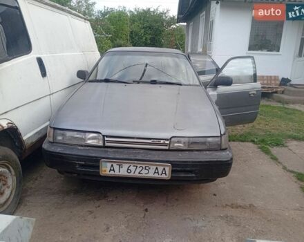Серый Мазда 626, объемом двигателя 1.8 л и пробегом 380 тыс. км за 650 $, фото 1 на Automoto.ua