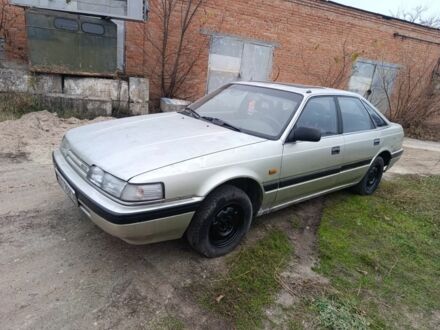 Серый Мазда 626, объемом двигателя 2 л и пробегом 280 тыс. км за 1300 $, фото 1 на Automoto.ua