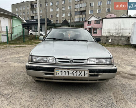 Серый Мазда 626, объемом двигателя 1.8 л и пробегом 245 тыс. км за 900 $, фото 1 на Automoto.ua