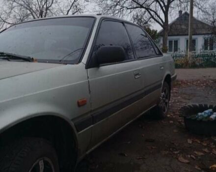 Серый Мазда 626, объемом двигателя 1.8 л и пробегом 594 тыс. км за 953 $, фото 1 на Automoto.ua