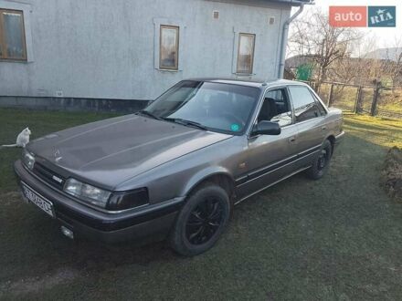 Серый Мазда 626, объемом двигателя 1.8 л и пробегом 330 тыс. км за 1500 $, фото 1 на Automoto.ua