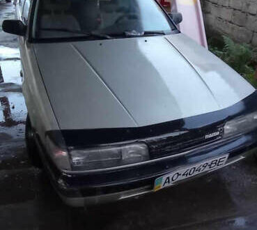 Серый Мазда 626, объемом двигателя 2 л и пробегом 322 тыс. км за 650 $, фото 1 на Automoto.ua