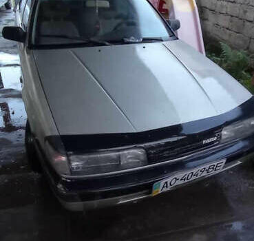 Серый Мазда 626, объемом двигателя 2 л и пробегом 322 тыс. км за 650 $, фото 1 на Automoto.ua