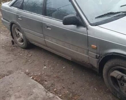 Серый Мазда 626, объемом двигателя 2 л и пробегом 200 тыс. км за 600 $, фото 1 на Automoto.ua