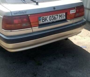 Серый Мазда 626, объемом двигателя 2 л и пробегом 300 тыс. км за 1200 $, фото 1 на Automoto.ua