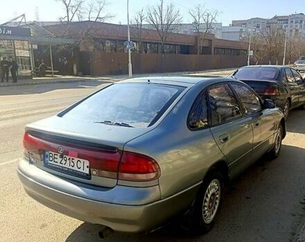 Серый Мазда 626, объемом двигателя 1.8 л и пробегом 256 тыс. км за 1500 $, фото 1 на Automoto.ua