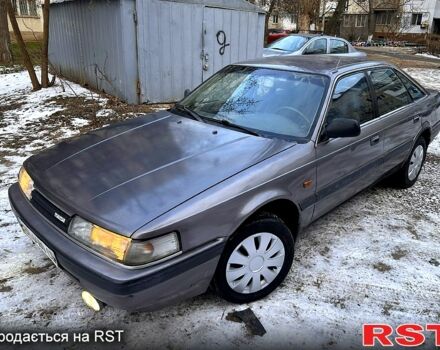 Серый Мазда 626, объемом двигателя 2 л и пробегом 200 тыс. км за 1200 $, фото 1 на Automoto.ua