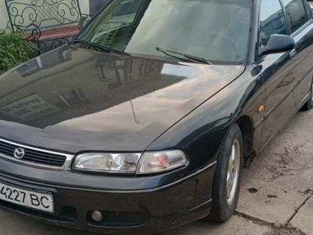 Серый Мазда 626, объемом двигателя 2 л и пробегом 312 тыс. км за 950 $, фото 1 на Automoto.ua